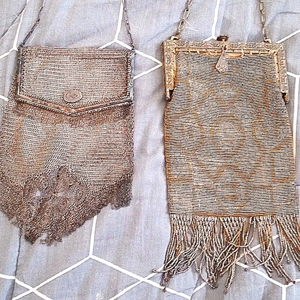 2 1920 s antique purses one is french steel the other sterling silver.